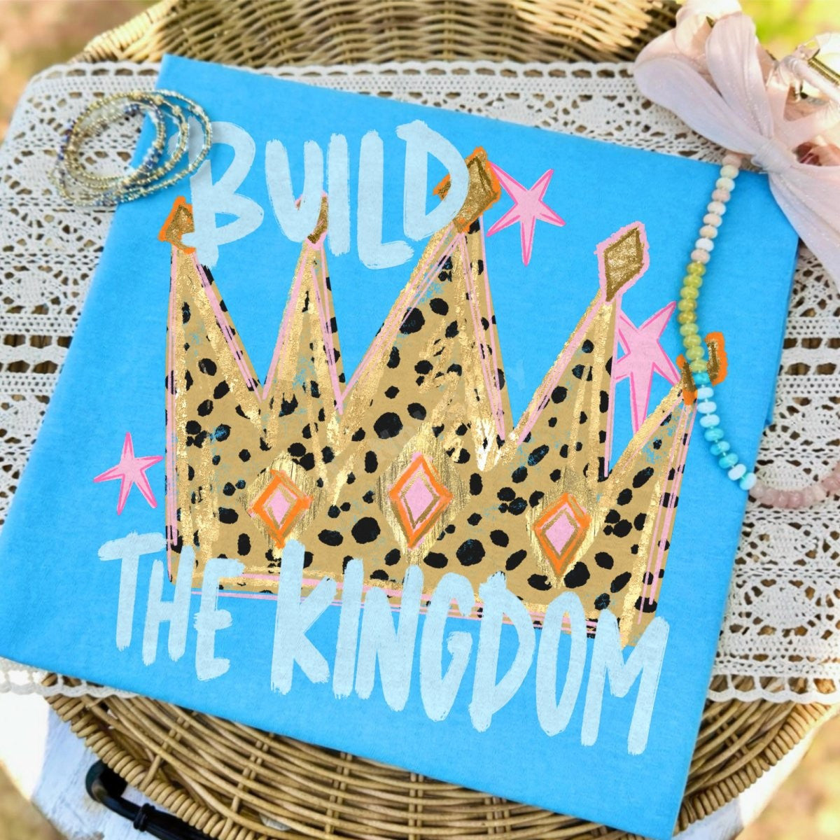 Build the Kingdom graphic tee — leopard and gold crown on blue