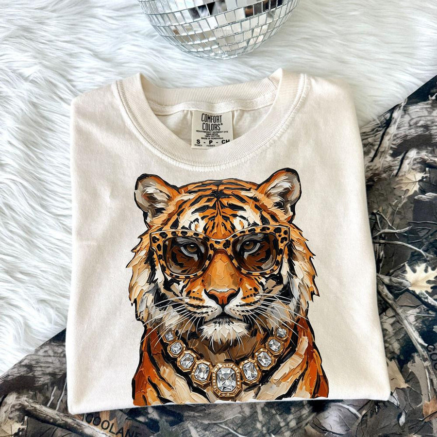 Glam tiger with leopard glasses and jeweled necklace on an ivory Comfort Colors tee